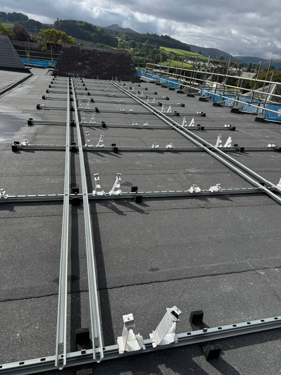 Solar panel mounting rails on flat roof