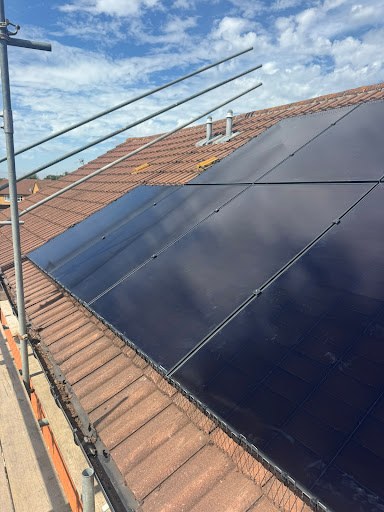 Susan’s rooftop solar panels with scaffolding during installation